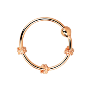 Micro piercing ring with three small rope coils rose gold